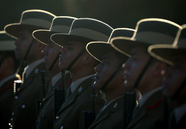 <p>Soldiers from the Brigade of Gurkhas await inspection during a passing-out ceremony </p>