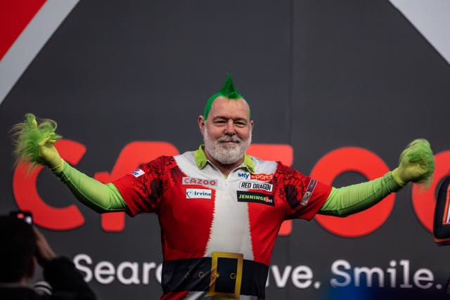Peter Wright gets in the festive spirit every year at Ally Pally (Steven Paston/PA)