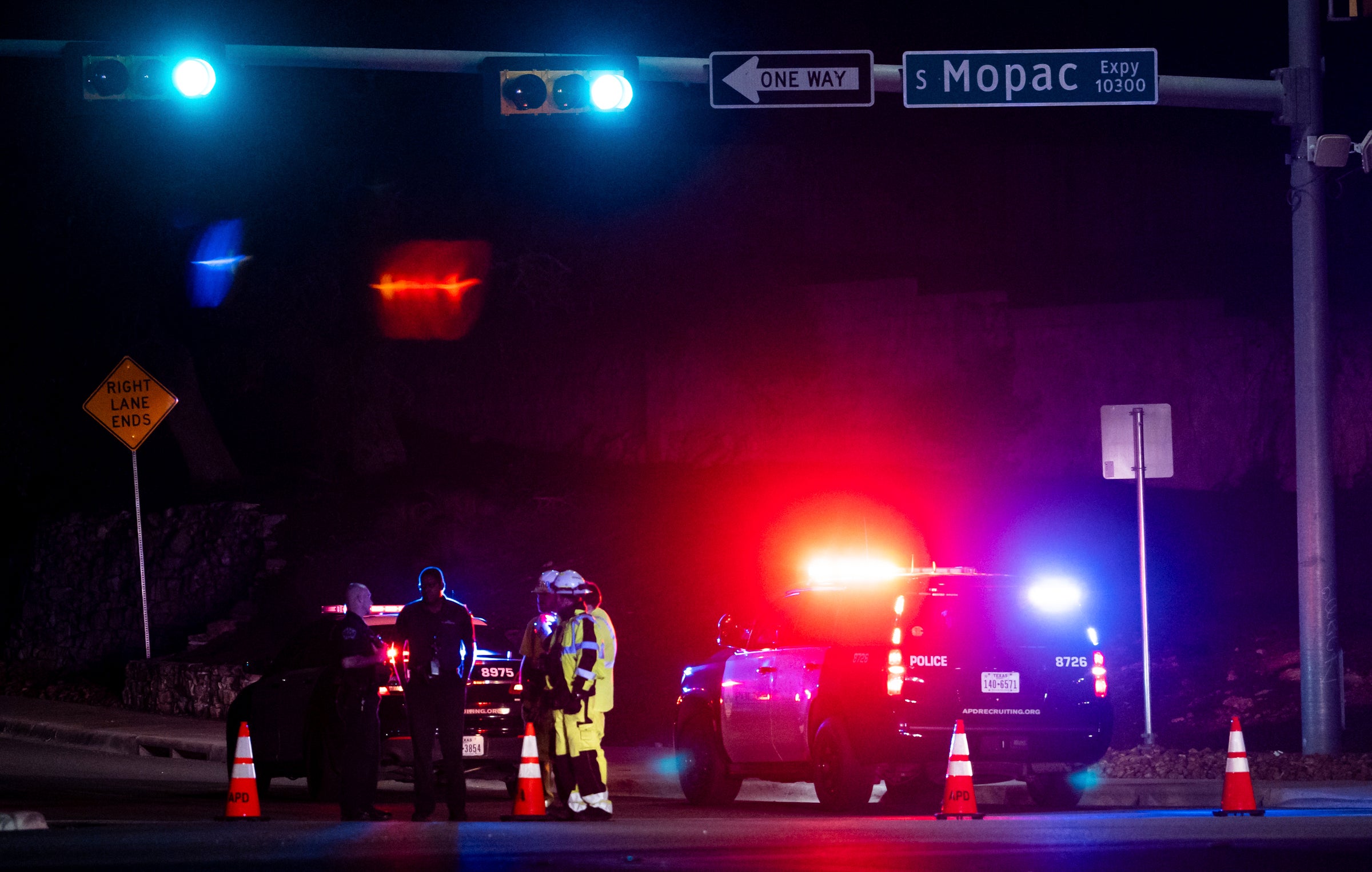 Austin Police officers close La Crosse Avenue near Mopac Expressway in Austin, Texas late Tuesday, Dec. 5, 2023. Texas