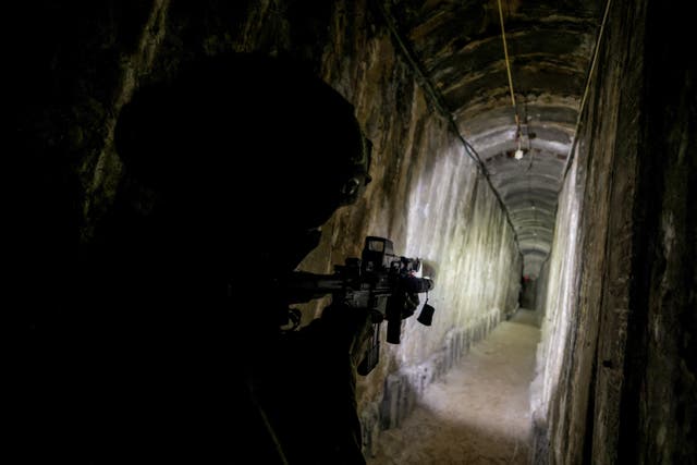 <p>An Israeli soldier secures a tunnel underneath Al Shifa Hospital in Gaza City</p>
