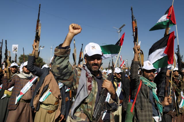 <p>Houthi fighters march in support of Palestine during a parade in Sanaa, Yemen, on 2 December</p>