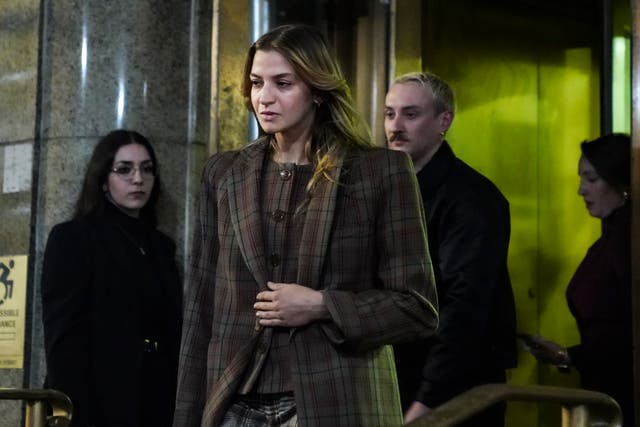 <p>Grace Jabbari, second from left, the accuser in the assault case against Jonathan Majors, leaves court after giving testimony, 5 December 2023, in New York</p>