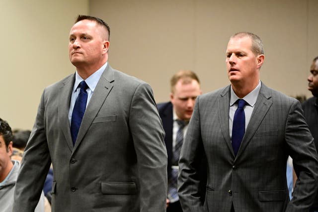<p>Paramedics Jeremy Cooper, left, and Peter Cichuniec attend an arraignment at the Adams County Justice Center in Brighton, Colorado in January 2023</p>
