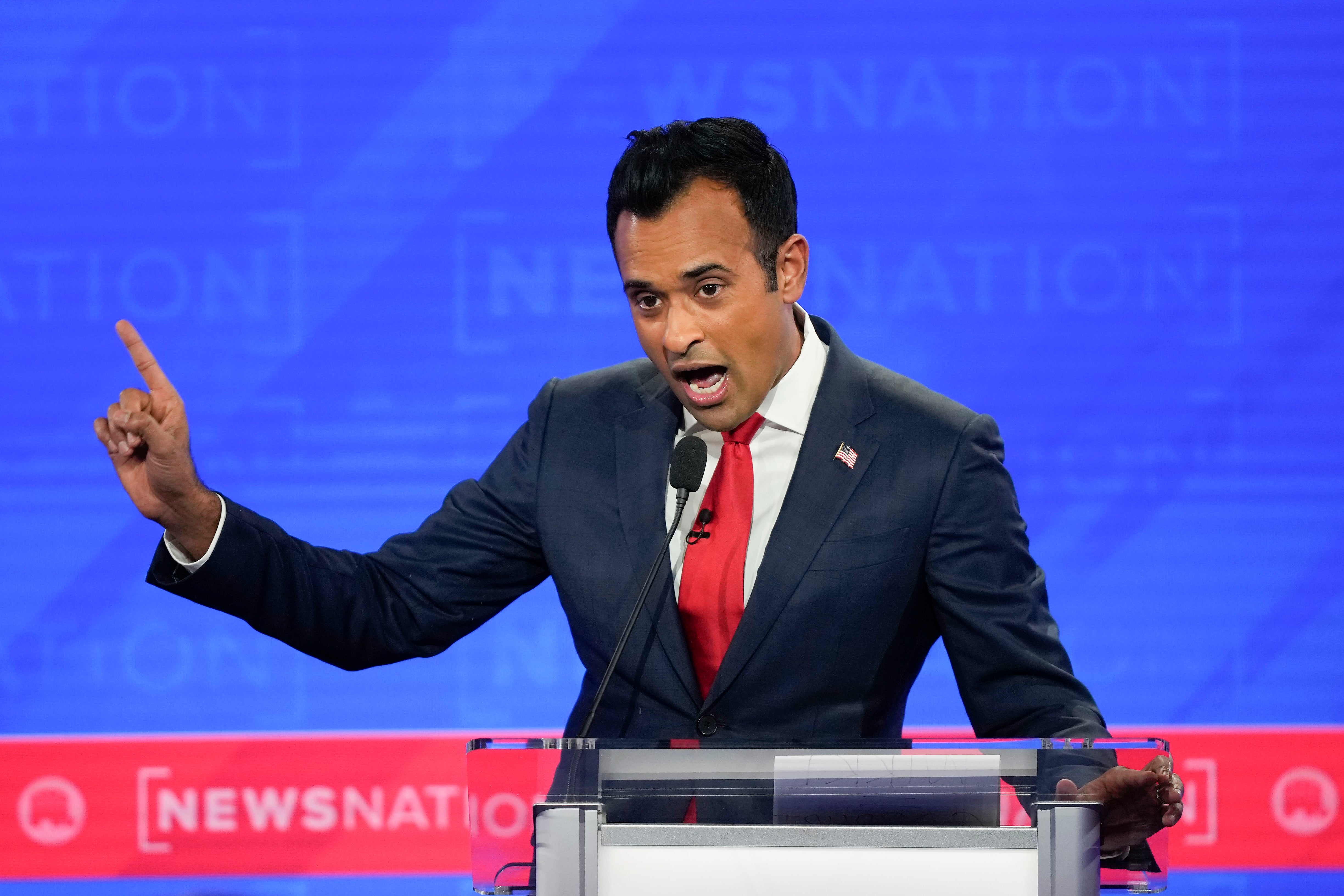 Republican presidential candidate businessman Vivek Ramaswamy gesturing during an exchange with former New Jersey Gov. Chris Christie during a Republican presidential primary debate hosted by NewsNation on Wednesday, Dec. 6, 2023, at the Moody Music Hall at the University of Alabama in Tuscaloosa