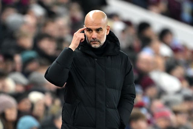 <p>Manchester City manager Pep Guardiola watches on from the touchline</p>