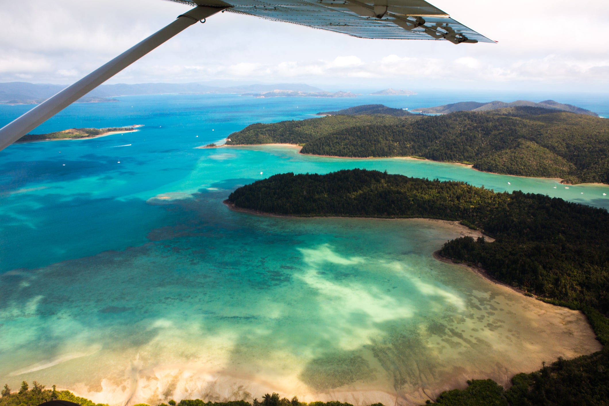 Queda livre de 15.000 pés acima do nível do mar em um passeio duplo pelo playground marinho de Airlie Beach