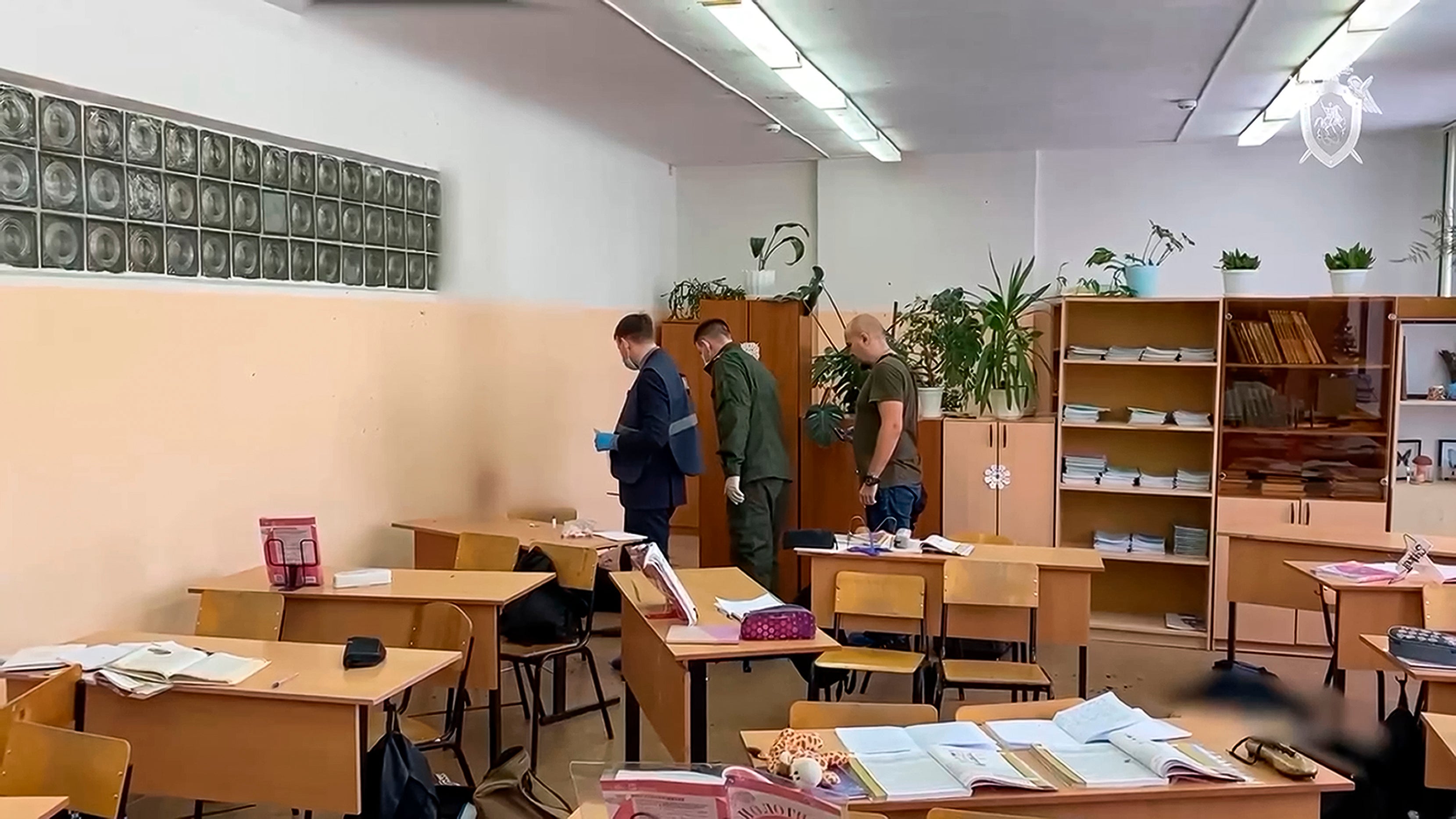 Investigators work at the scene of a shooting by Alina Afanaskina in a classroom of a school in Bryansk, Russia, in December