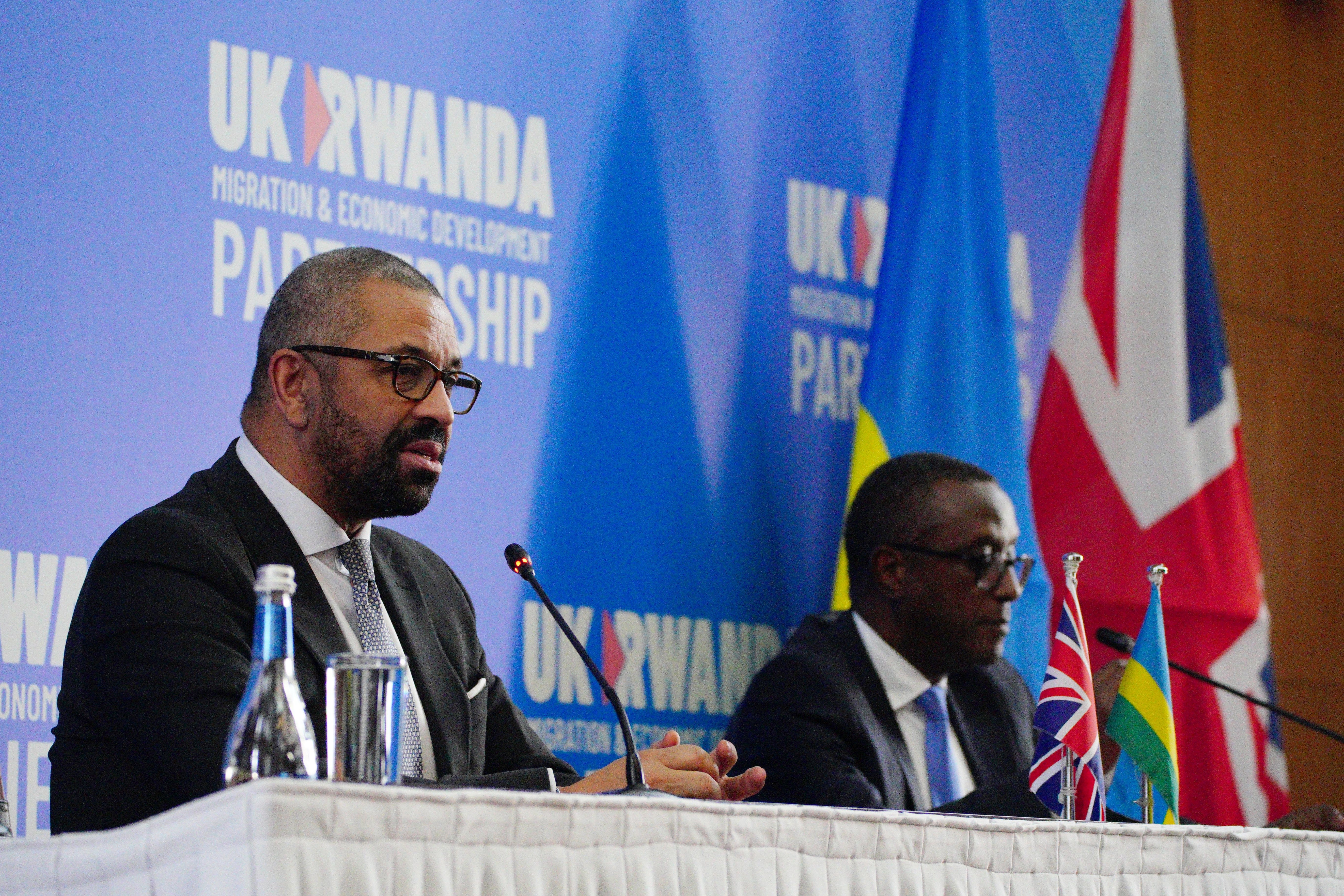 Home Secretary James Cleverly speaks during a press conference with Rwandan Minister of Foreign Affairs Vincent Biruta after the signing of a new treaty in the capital Kigali (PA)