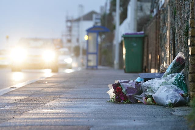 Flowers and messages left at the scene in Sandgate, near Folkestone (Gareth Fuller/PA)