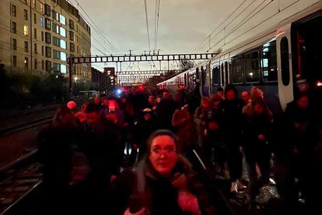 Passengers were evacuated from trains on to the tracks (Emma Bentley/PA)