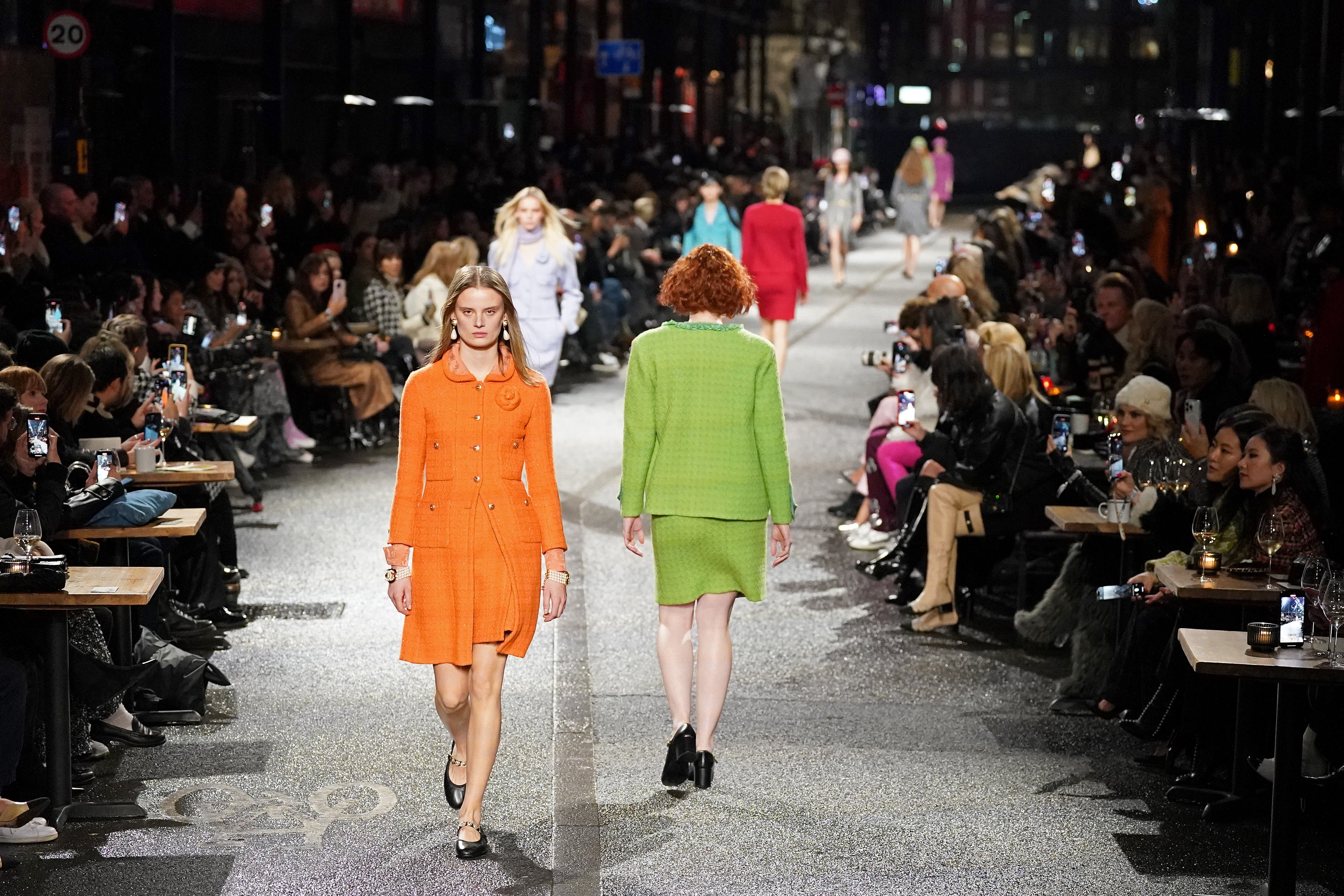 Models walk the runway during the Chanel Metiers D’Art Fashion Show