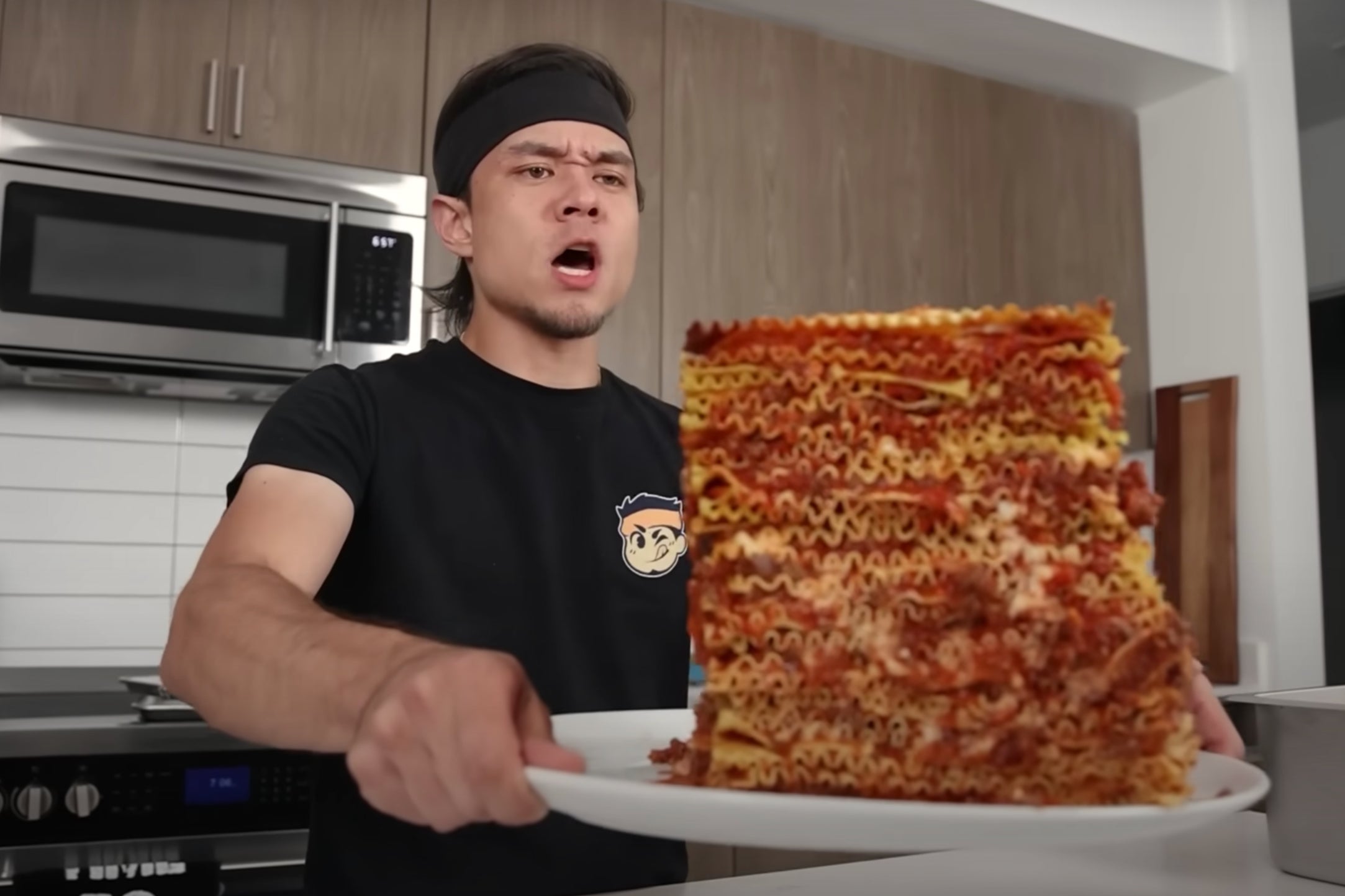 Competitive eating influencer Matt Stonie shows off a 100-layer lasagna