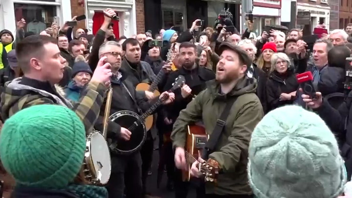 Shane MacGowan funeral: Crowds sing Fairytale of New York as they line Dublin streets in tribute