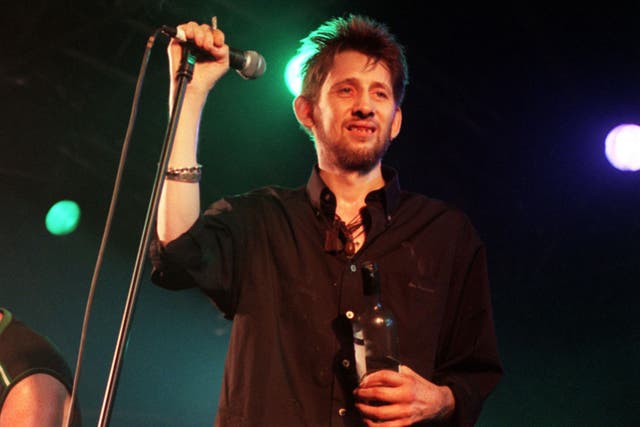 Mourners lined the streets of Dublin to say goodbye to the Pogues frontman at a public procession on Friday ahead of his funeral (Michael Walter/PA)