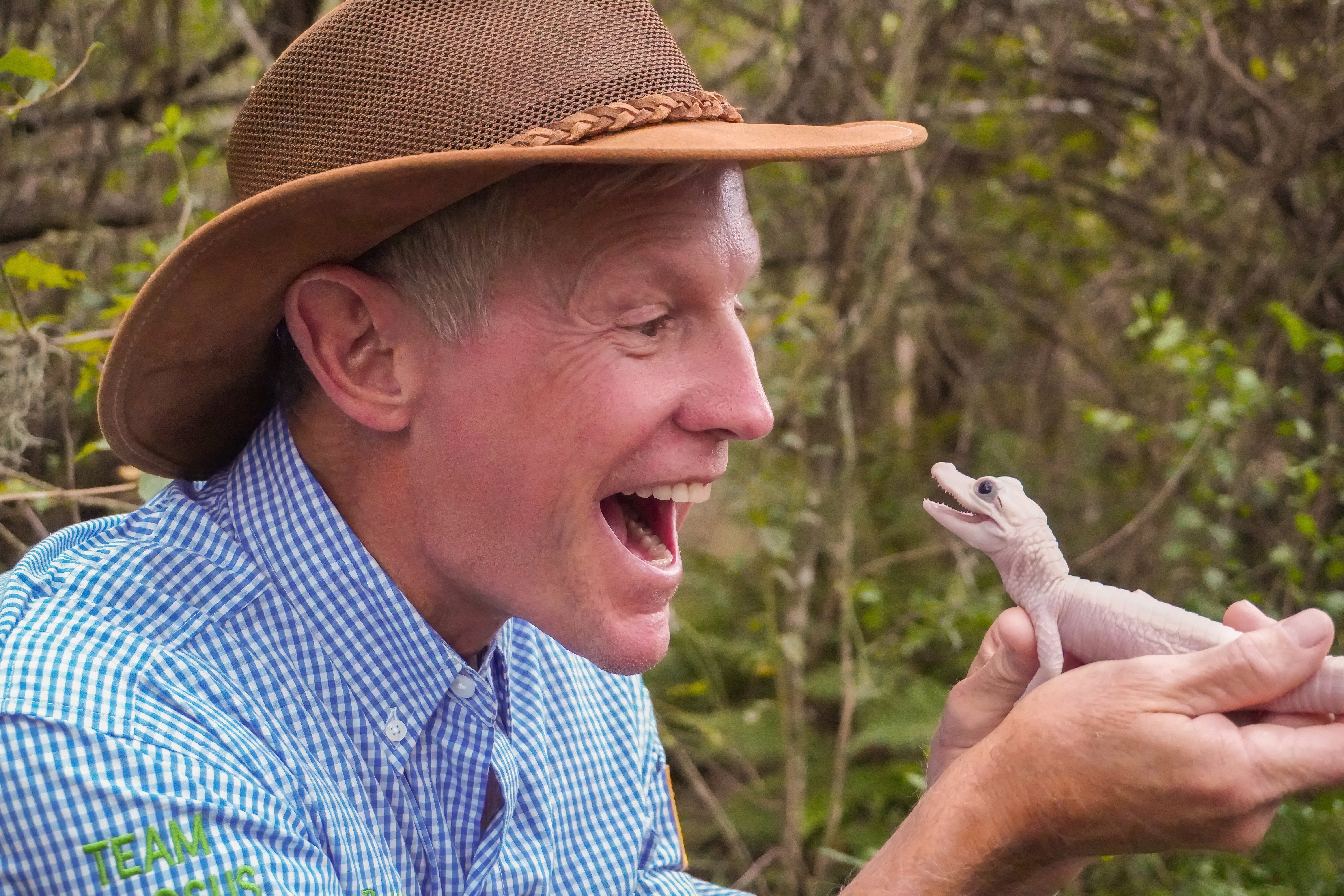 Gatorland’s CEO Mark McHugh smiling with the new baby