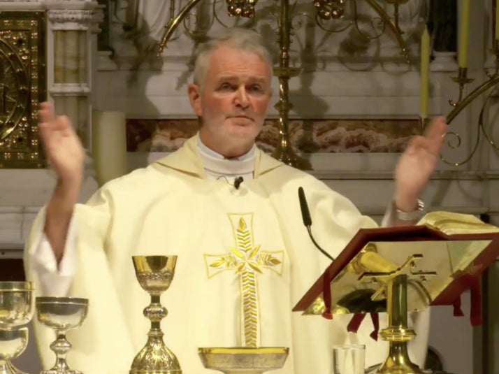 Father Gilbert delivers the Eucharist Prayer