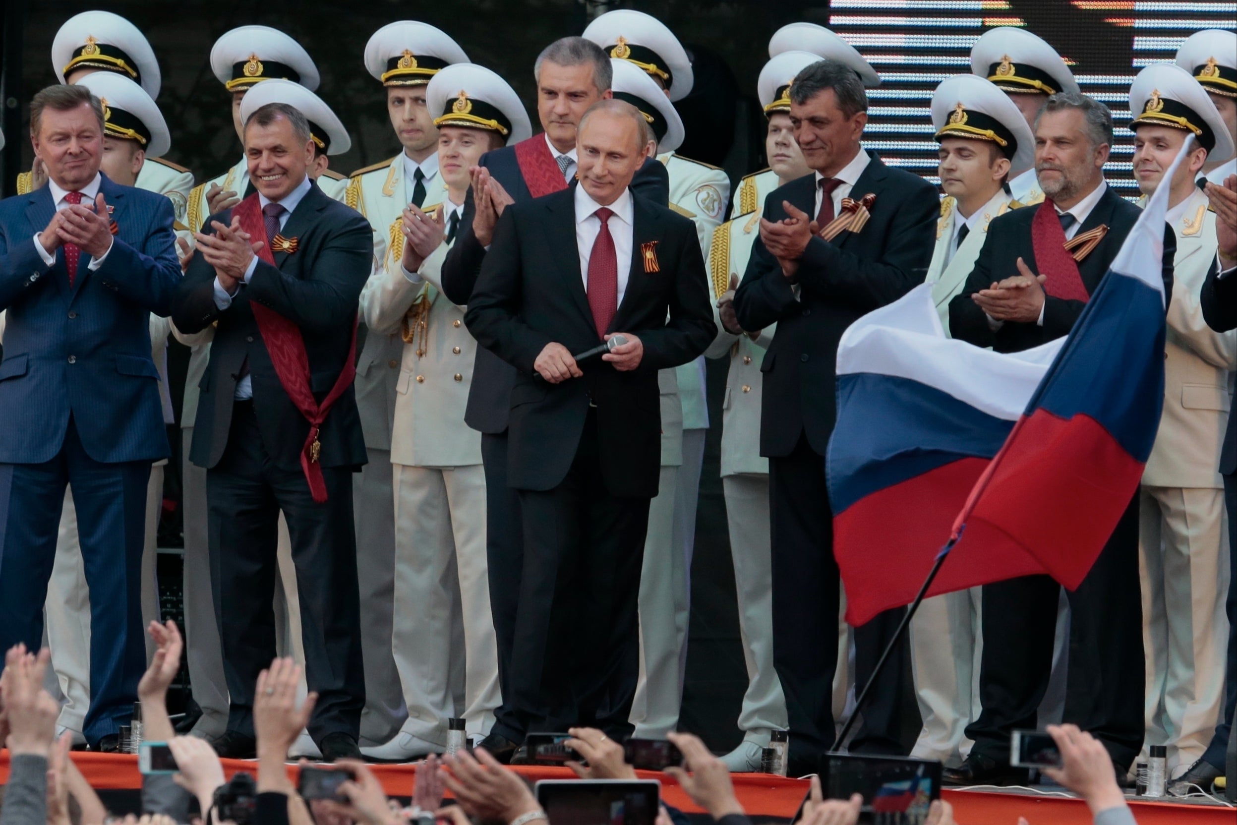 Vladimir Putin is applauded after speaking at a gala concert marking Victory Day in Sevastopol, Crimea, on 9 May 2014.