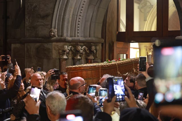 Johnny Depp (centre left) carries the coffin of Shane MacGowan following his funeral (Damien Eagers/PA)