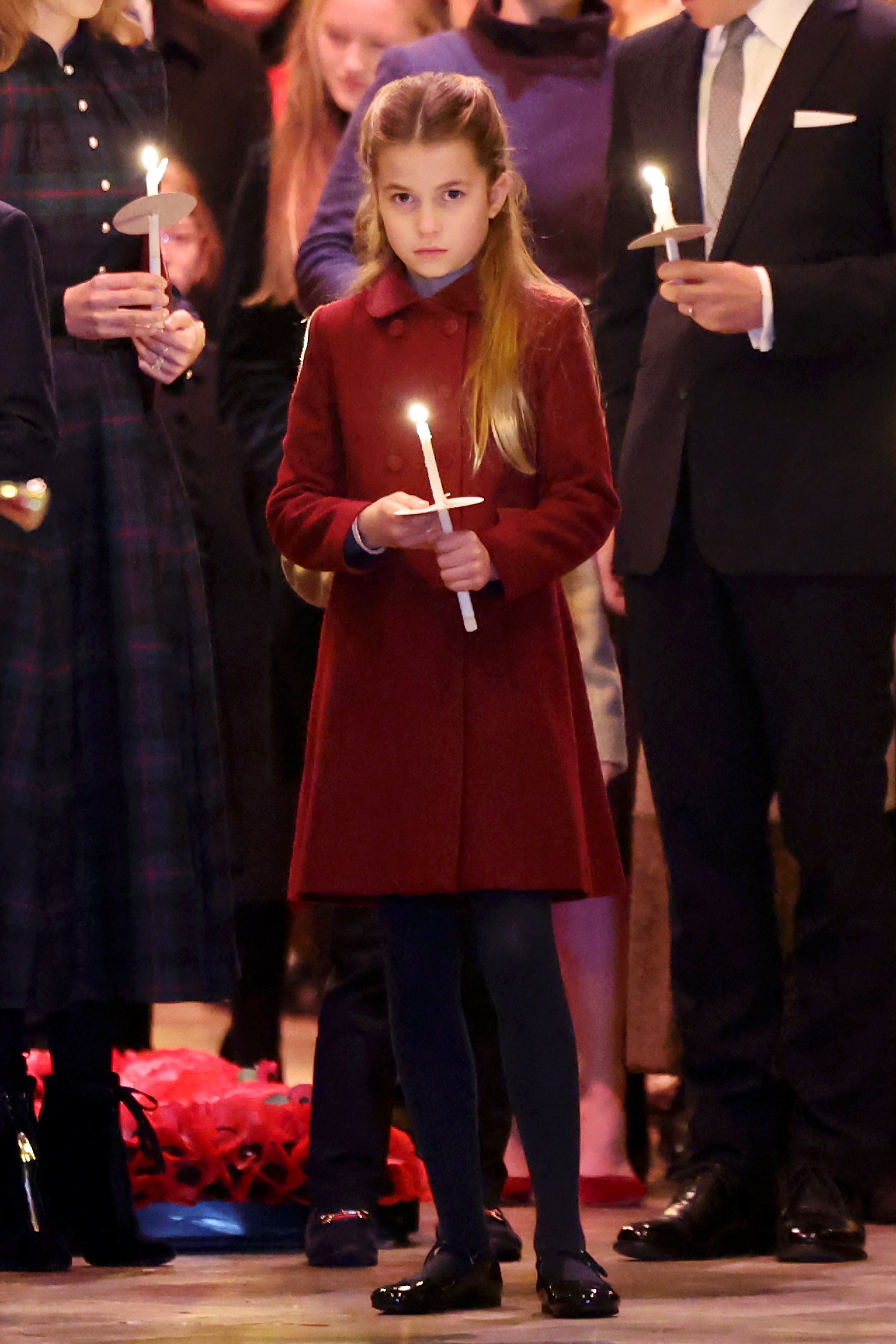 <p>Princess Charlotte wears a cheerful red coat for the festive occasion </p>
