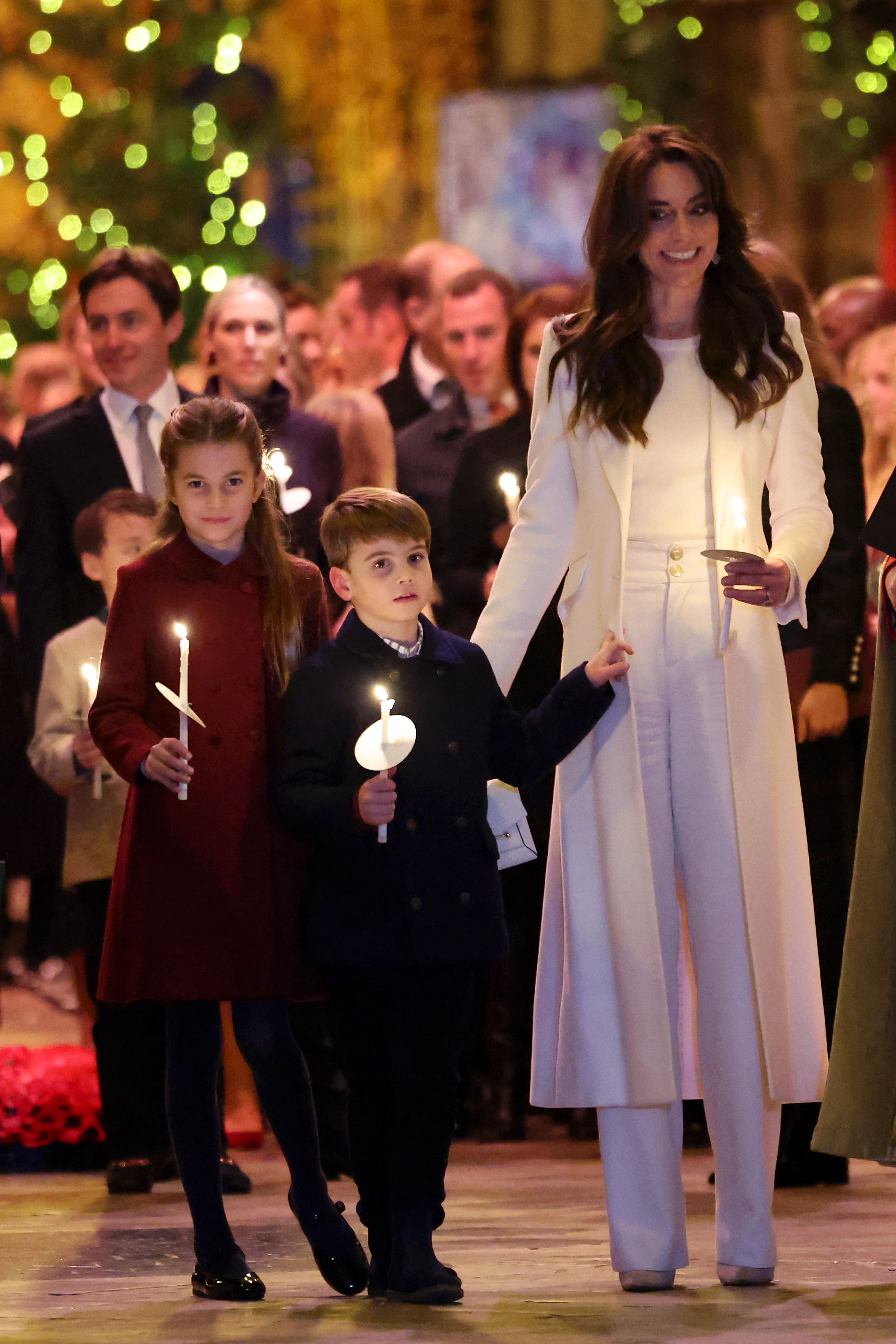 <p>Prince Louis and Princess Charlotte dutifully hold candles at their mother’s event  </p>