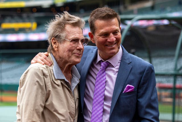 Patrick O’Neal poses with his father, actor Ryan O’Neal (AP Photo/Alex Gallardo, File/PA)