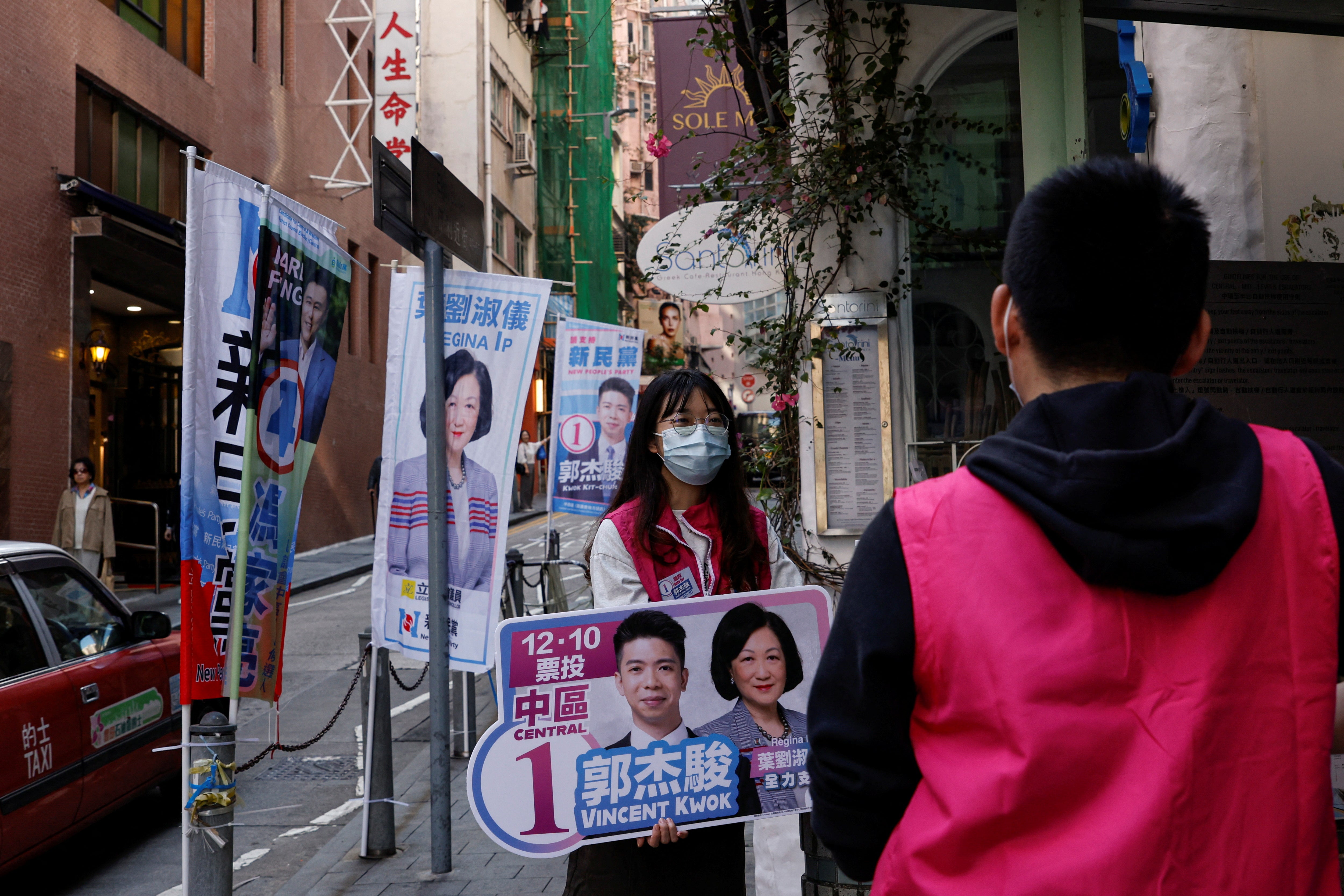 A volunteer campaigns for the New People’s Party during the District Council election in Hong Kong