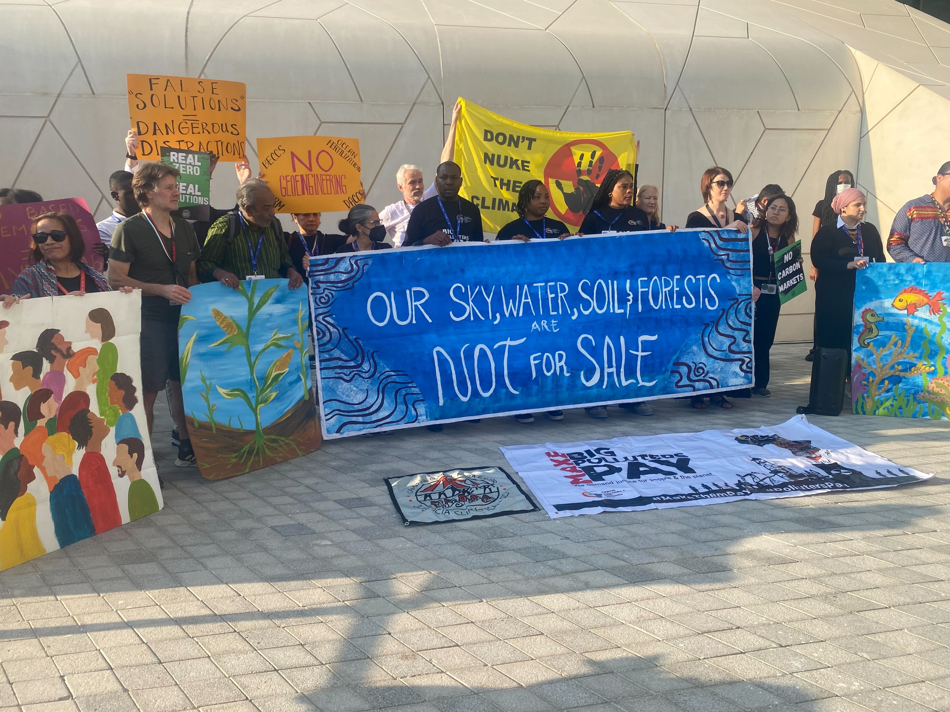 Activists stage protest against ‘false solutions’ at Cop28 summit in Dubai on Friday