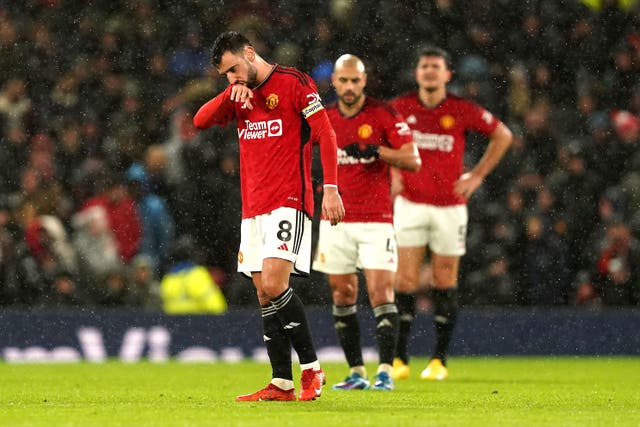 Bruno Fernandes (left) and team-mates look dejected after a crushing home defeat (Martin Rickett/PA)