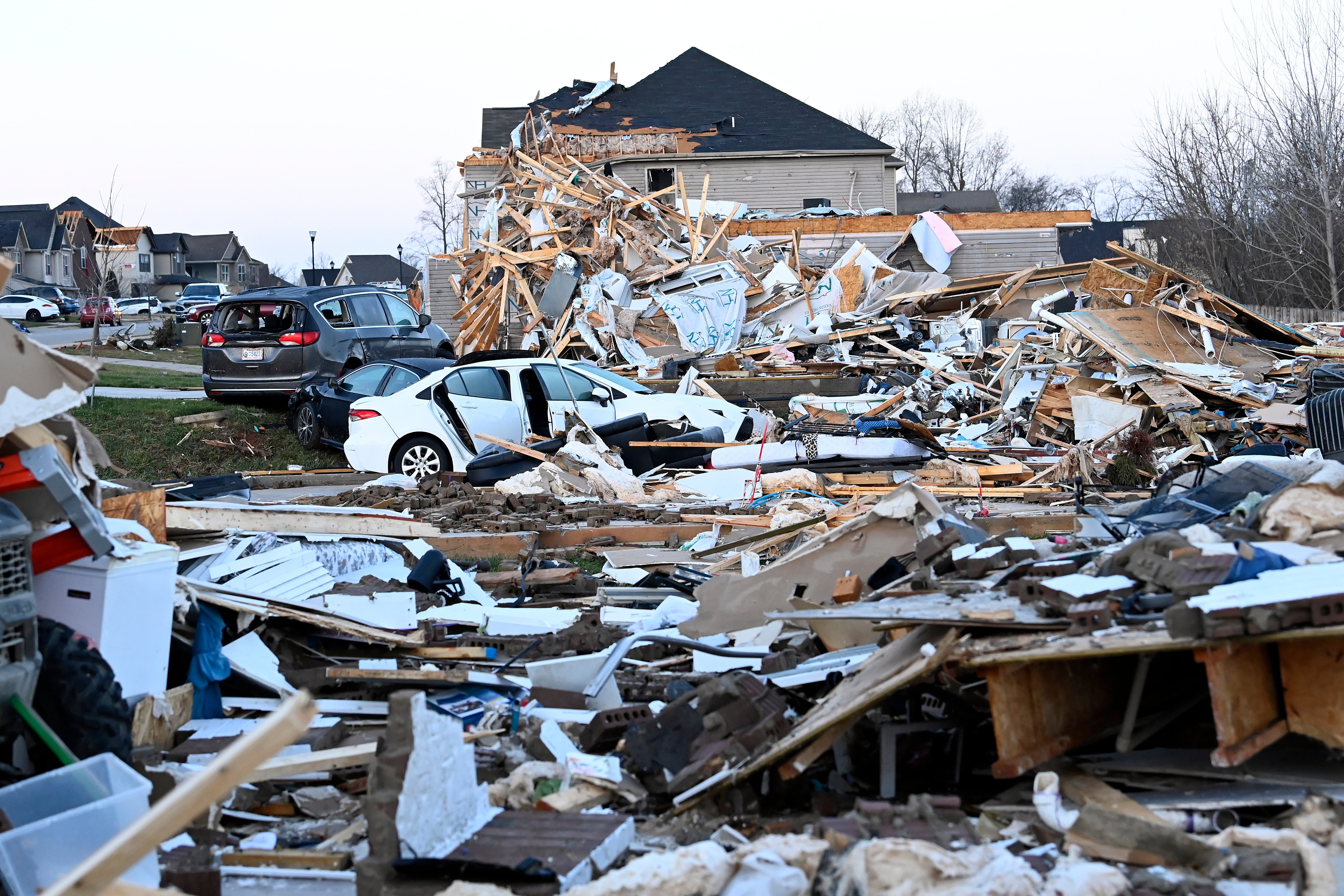 Debris covers the area around homes destroyed in the West Creek Farms neighbourhood of Clarksville, Tennessee on Sunday