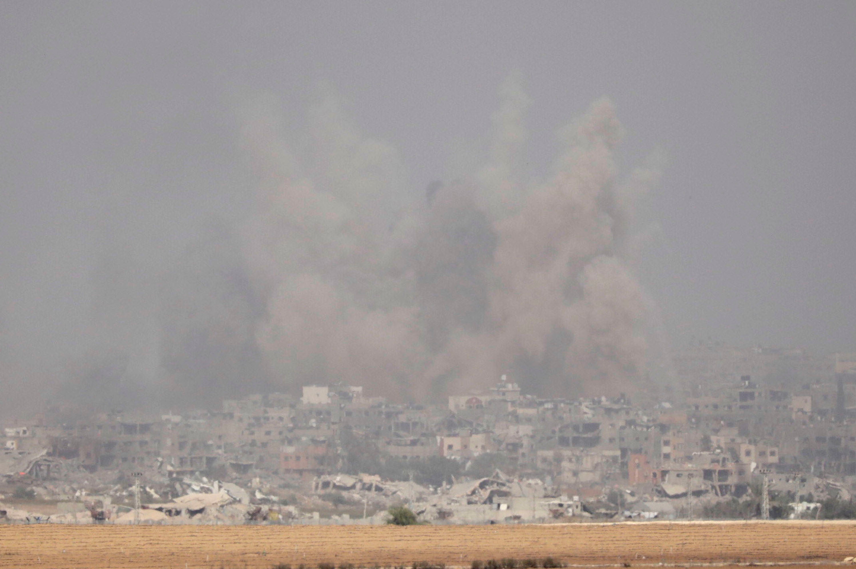 Smoke rises from northern Gaza as seen from the Israeli side of the border on Sunday