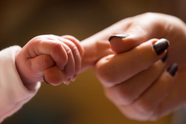 Data published by NHS England showed the number of births in the country is at its lowest level in more than 20 years (PA)