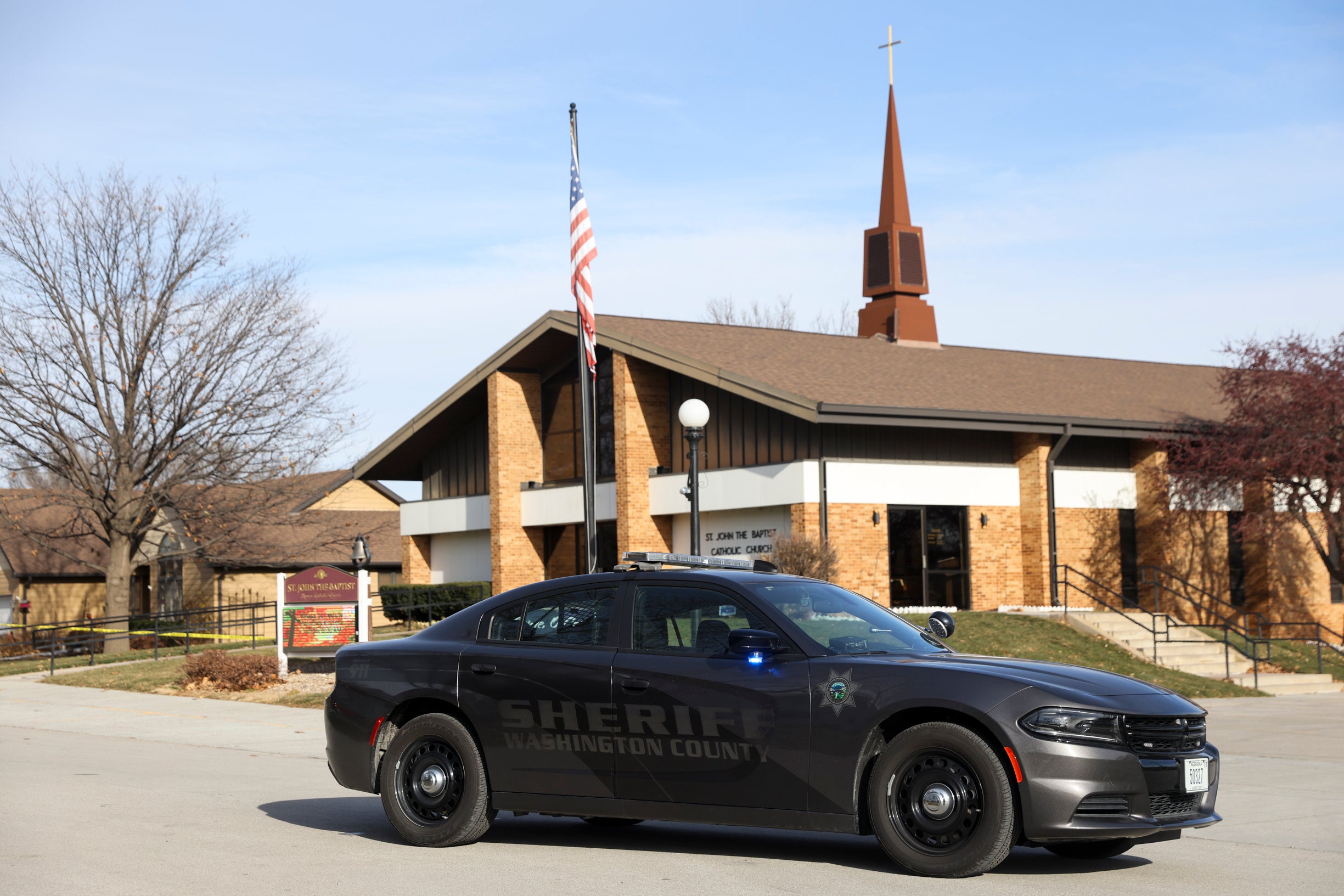 The Washington County Sheriff's office investigates the scene of a fatal stabbing on a Catholic priest in the rectory of St. John the Baptist Church