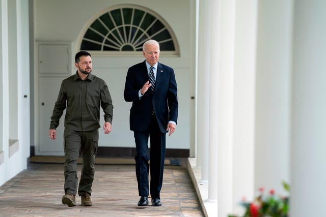 <p>FILE: Volodymyr Zelensky (L) walks with Joe Biden down the colonnade to the Oval Office during visit to White House </p>