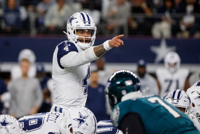 Dallas Cowboys quarterback Dak Prescott gestures before taking a snap against the Philadelphia Eagles (Michael Ainsworth/AP)