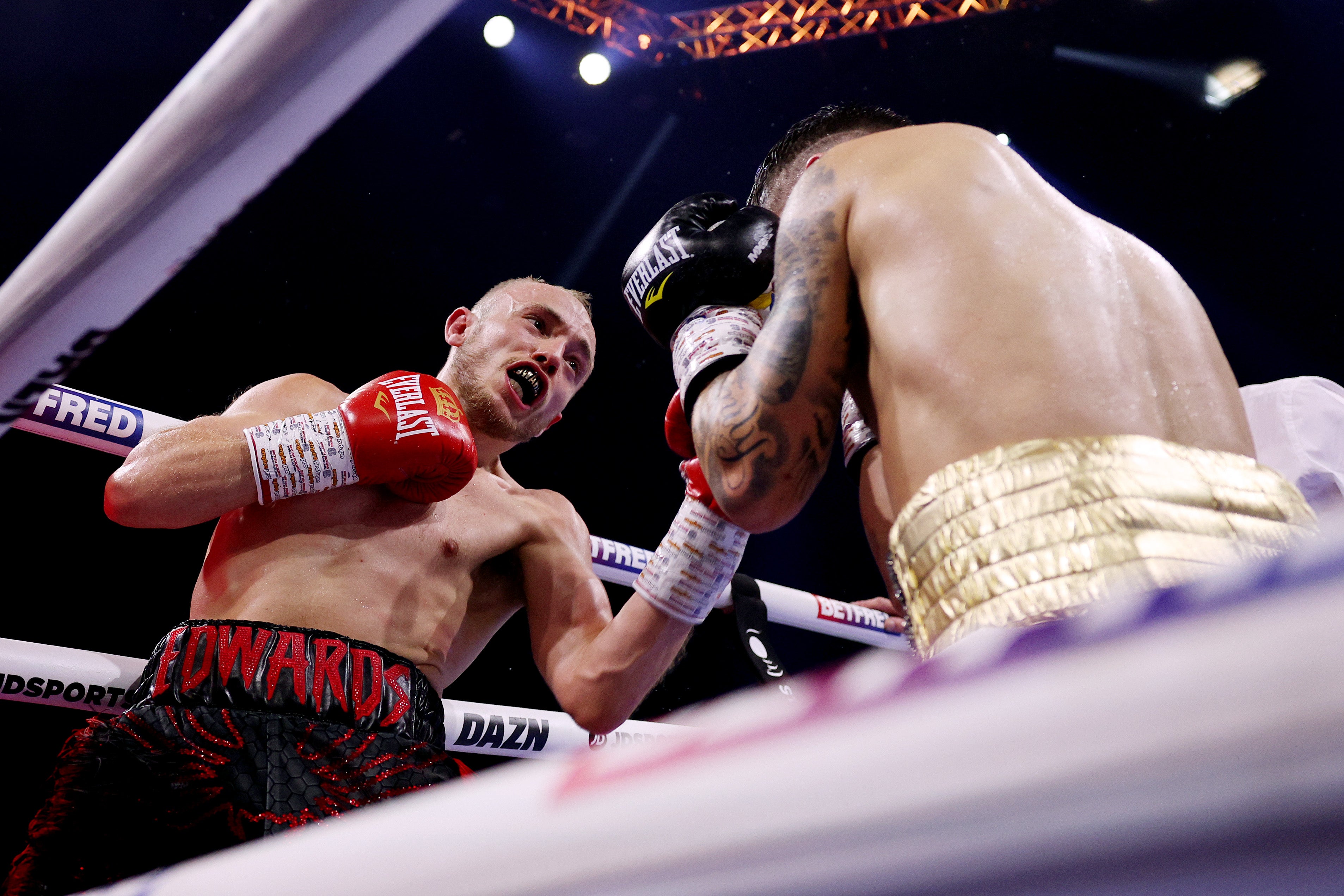 Edwards, left, en route to a decision win over Andres Campos in June
