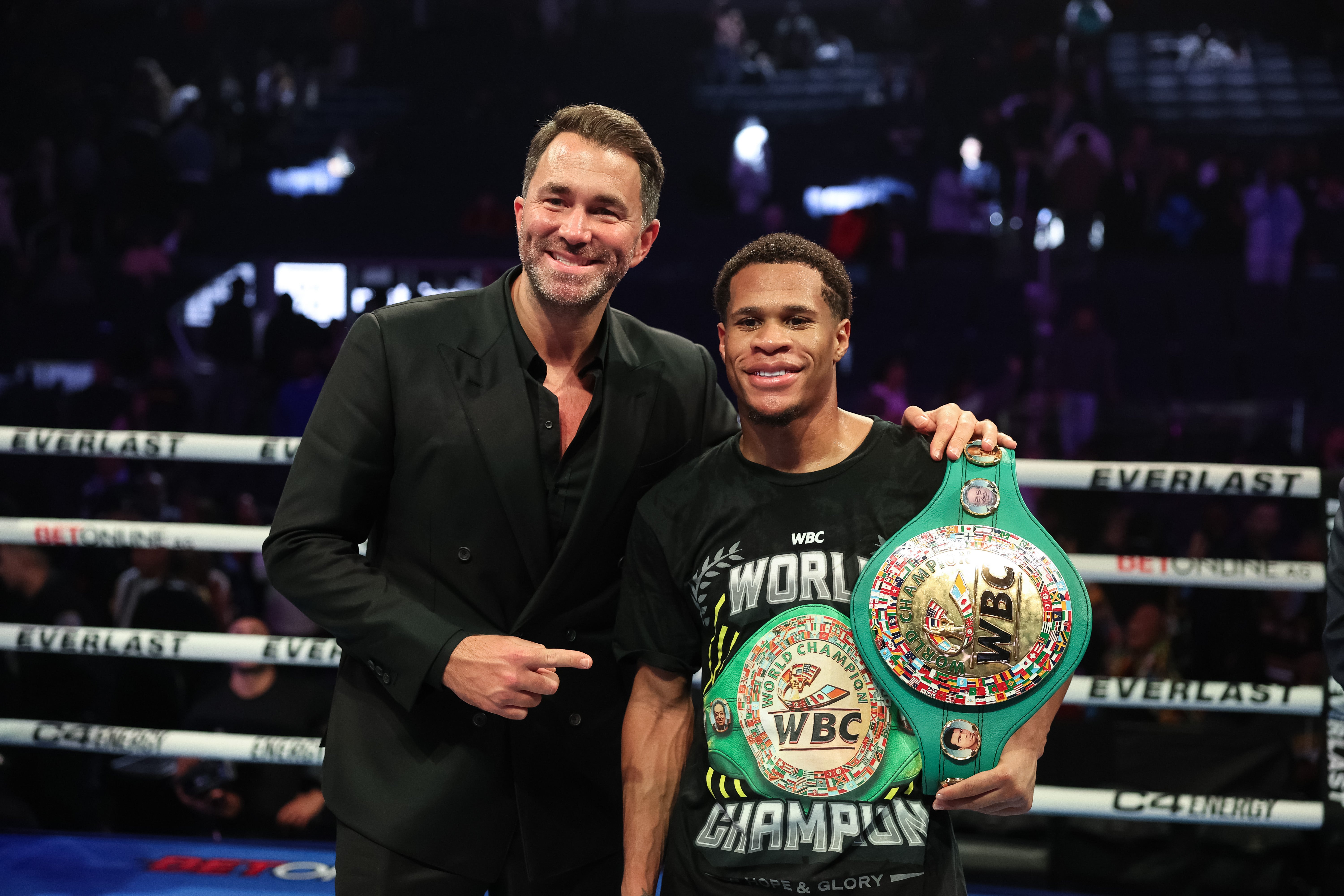 Haney celebrates with promoter Eddie Hearn after beating Prograis