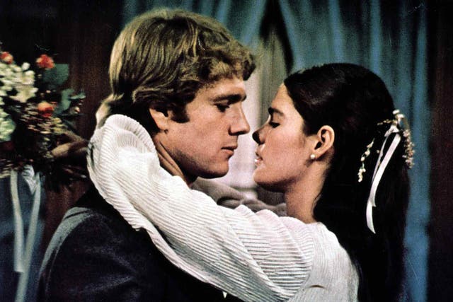<p>Ryan O’Neal and Ali MacGraw clutch each other in <em>Love Story  </em></p>