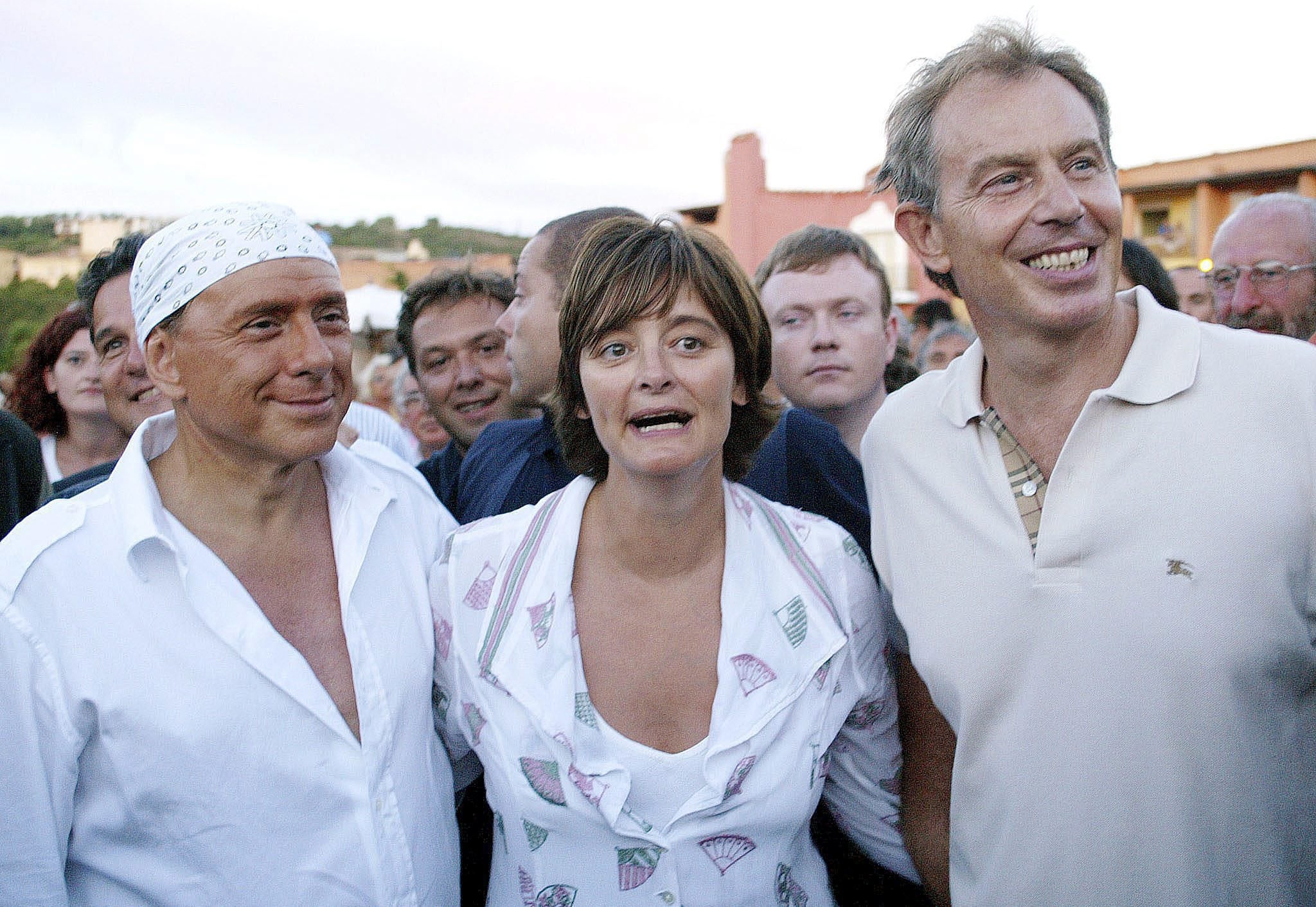 British Prime Minister Tony Blair (R) and his wife Cherie (C) meet with Italian Premier Silvio Berlusconi (L) in Porto Cervo, Sardinia Island, Italy, Monday 16 August 2004