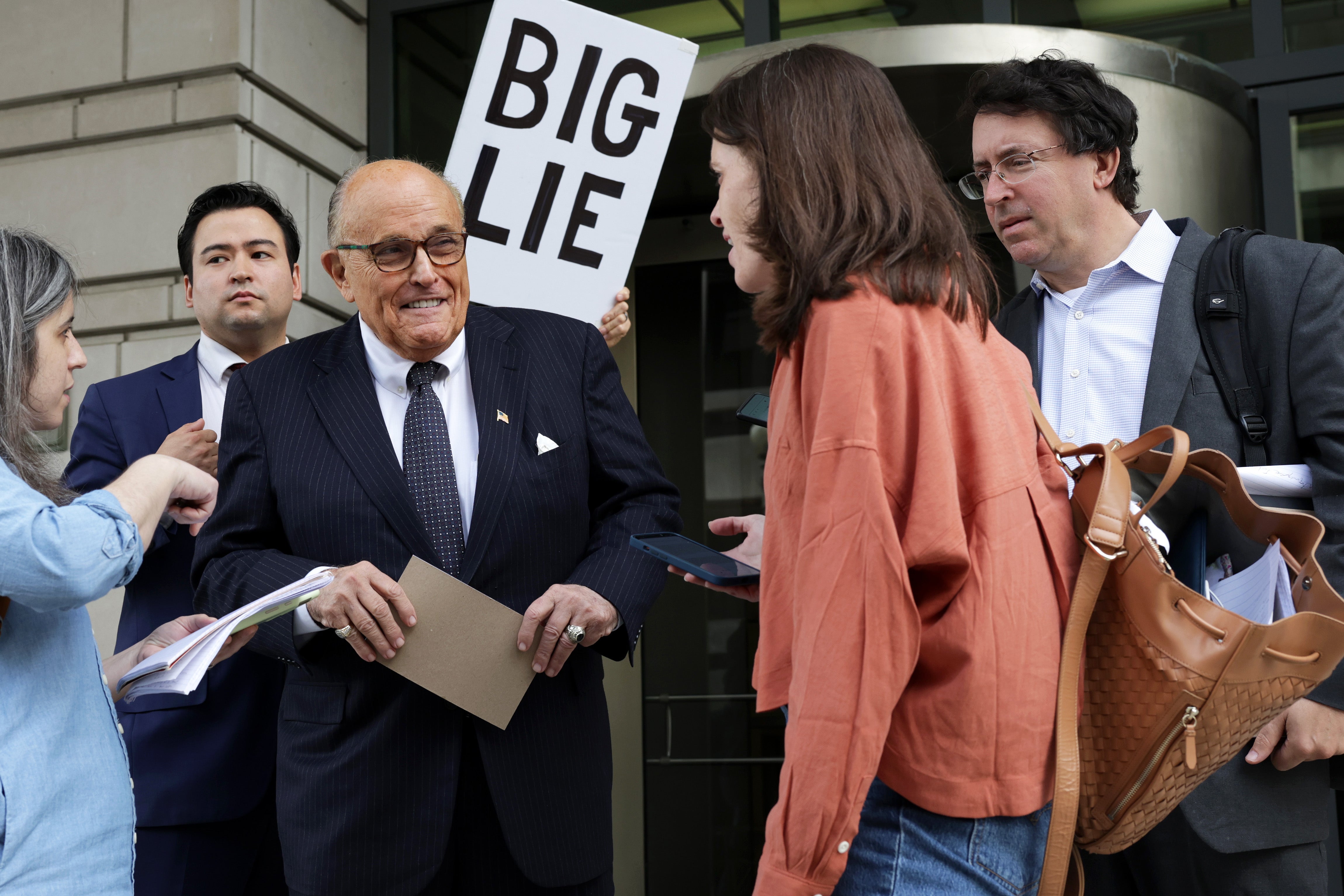 Rudy Giuliani is pictured leaving federal court in Washington DC on 19 May