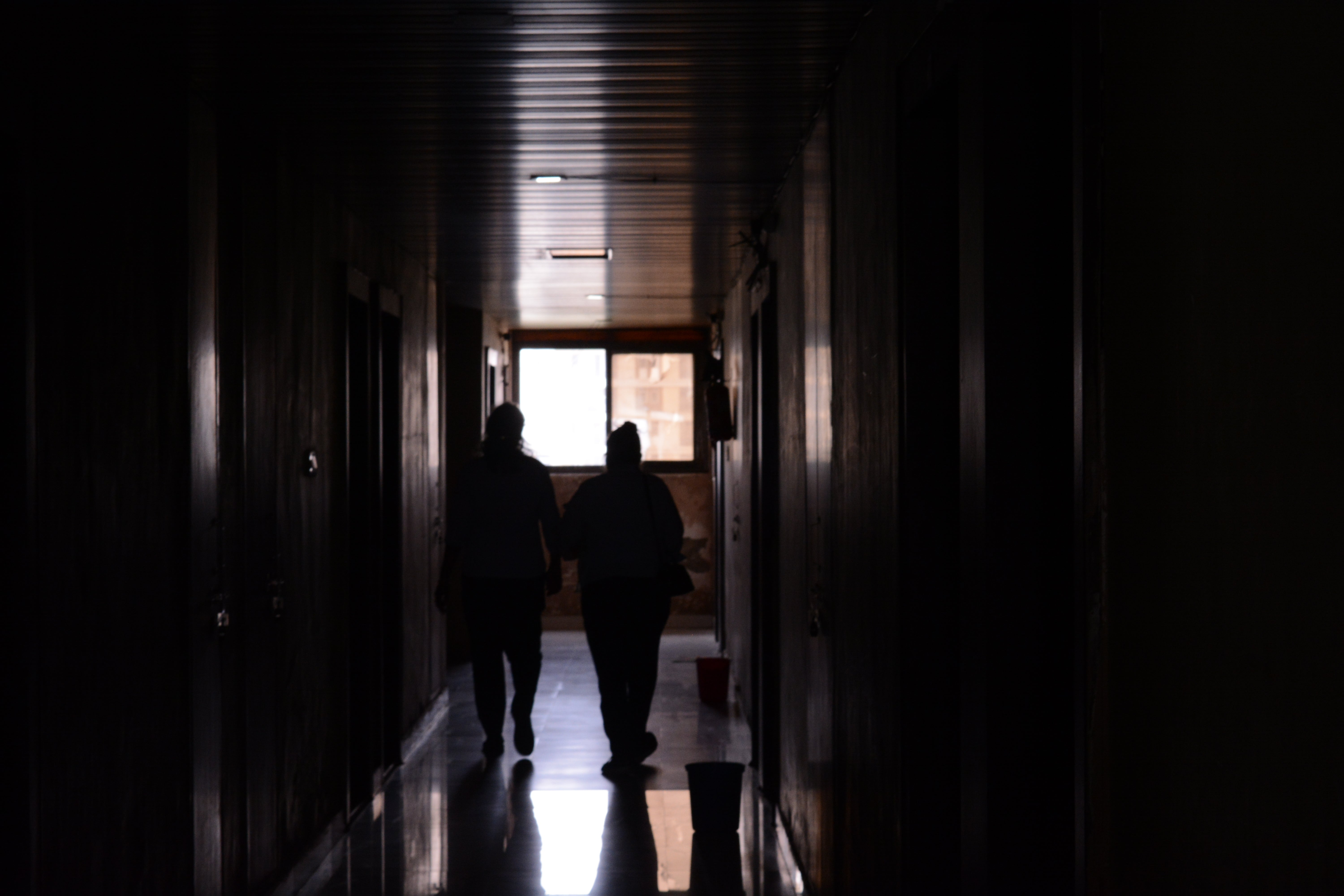 Students walking in the hostel corridors