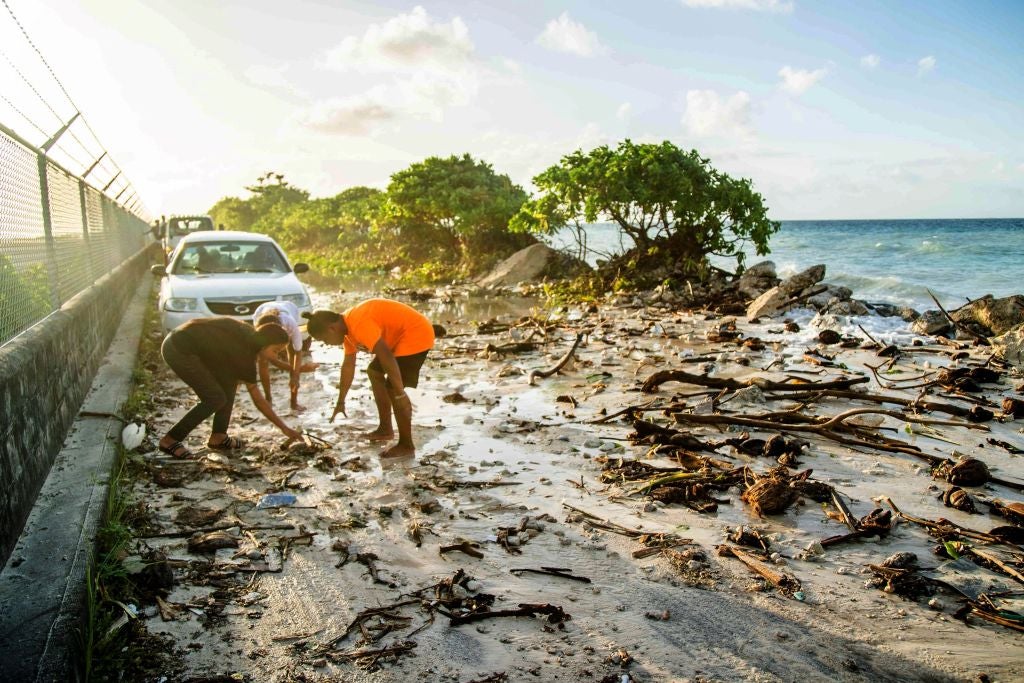 High-tide flooding and debris covering the road to the airport in the Marshall Islands capital Majuro in December 2021