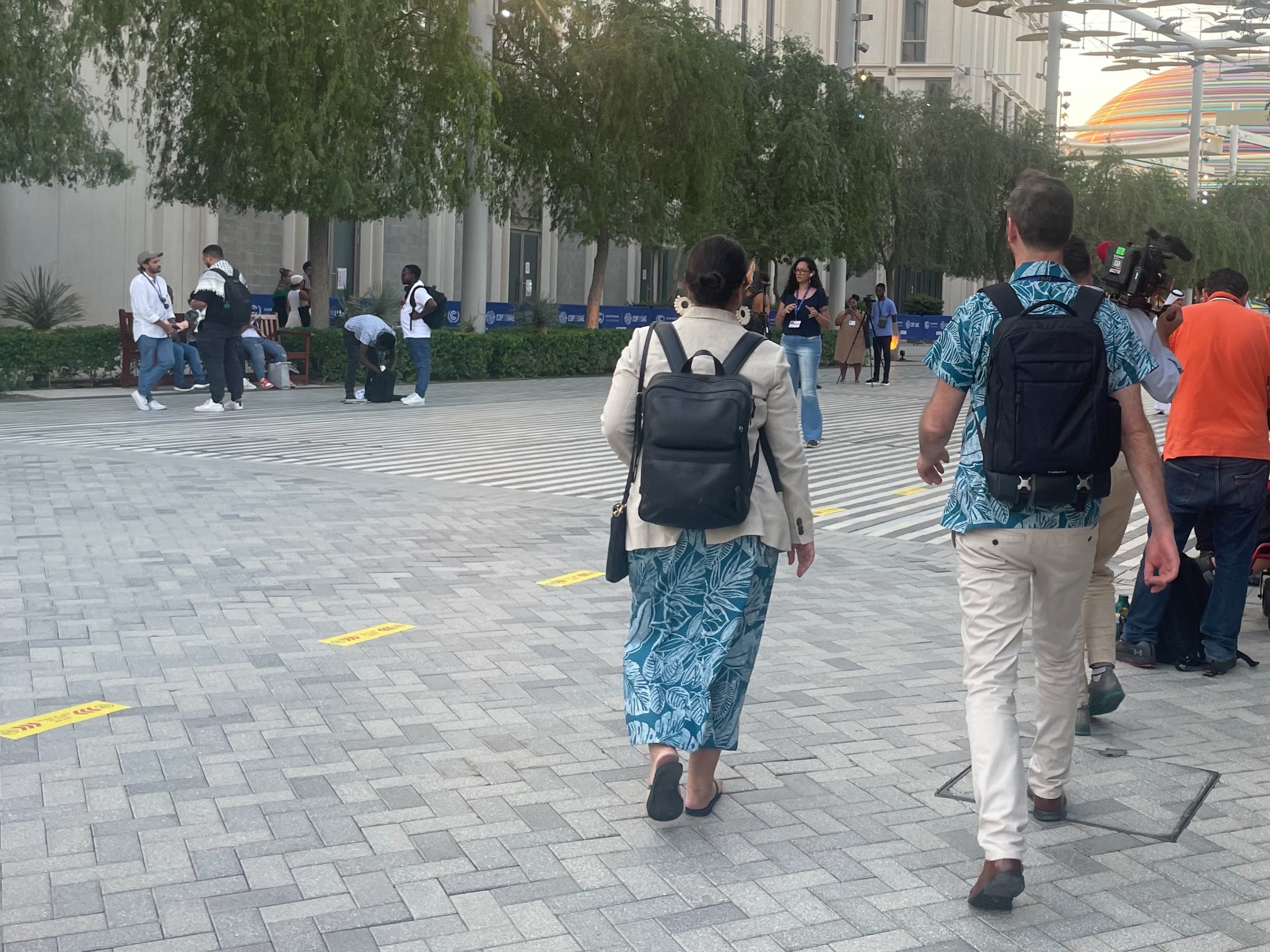 Tina Stege and a colleague make their way across the vast Cop28 venue