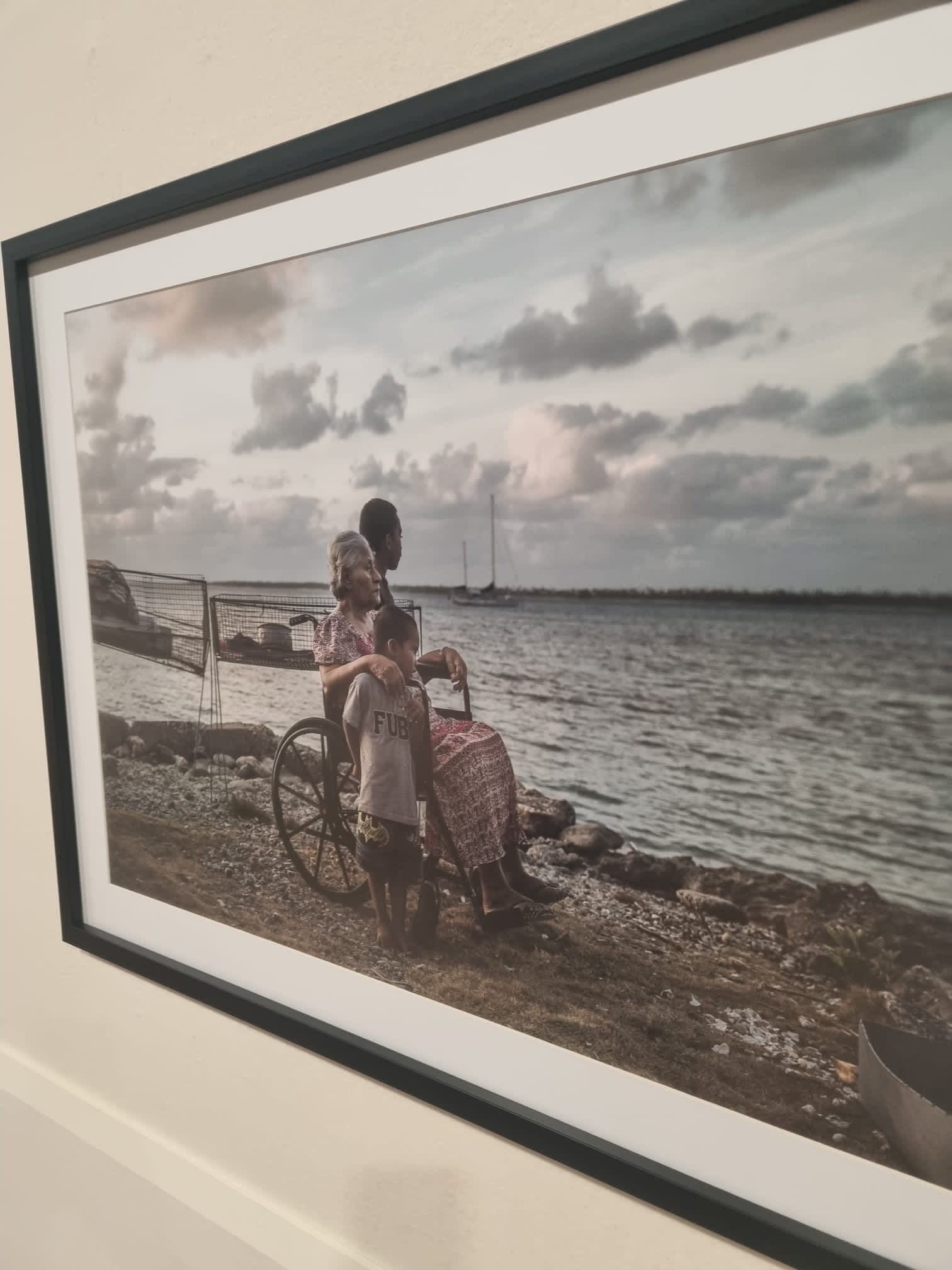 The photo of Theresa de Brun, Tina Stege’s great aunt, and her grandchildren on display inside the Cop28 venue. The image bears witness to the scale of the erosion caused by sea level rise on the remote outer island of Likiep in the Marshall Islands