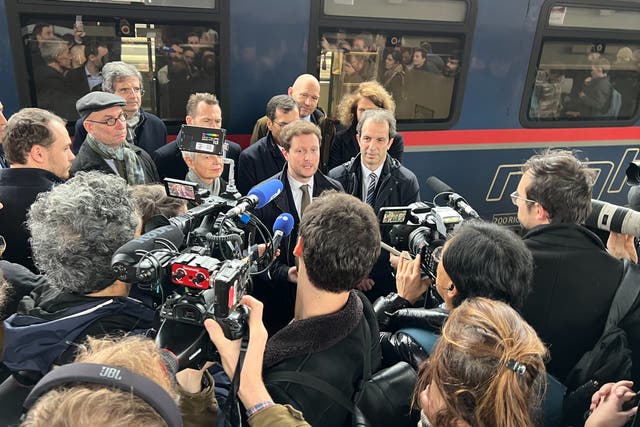 <p>Action station: Clément Beaune, French transport minister, speaking to reporters beside the revived Berlin-Paris sleeper train</p>