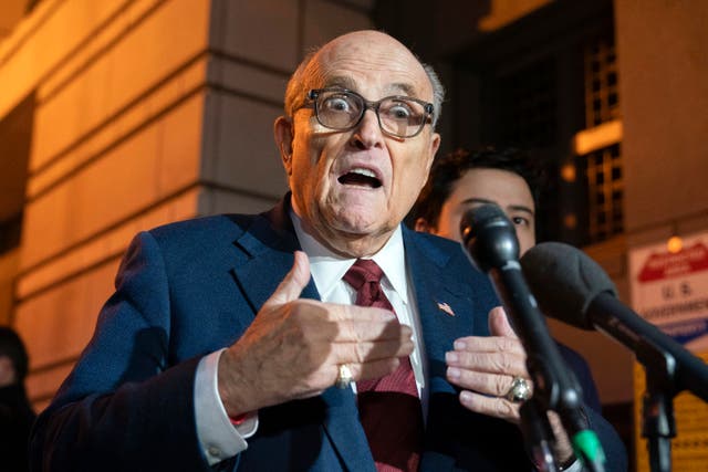 <p>Former New York Mayor Rudy Giuliani talks to reporters as he leaves the federal courthouse in Washington, Monday, Dec. 11, 2023</p>