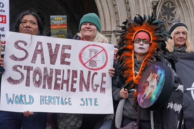 <p>Campaigners outside the High Court in London amid a bid to block a controversial road project featuring a tunnel near Stonehenge (Lucy North/PA)</p>