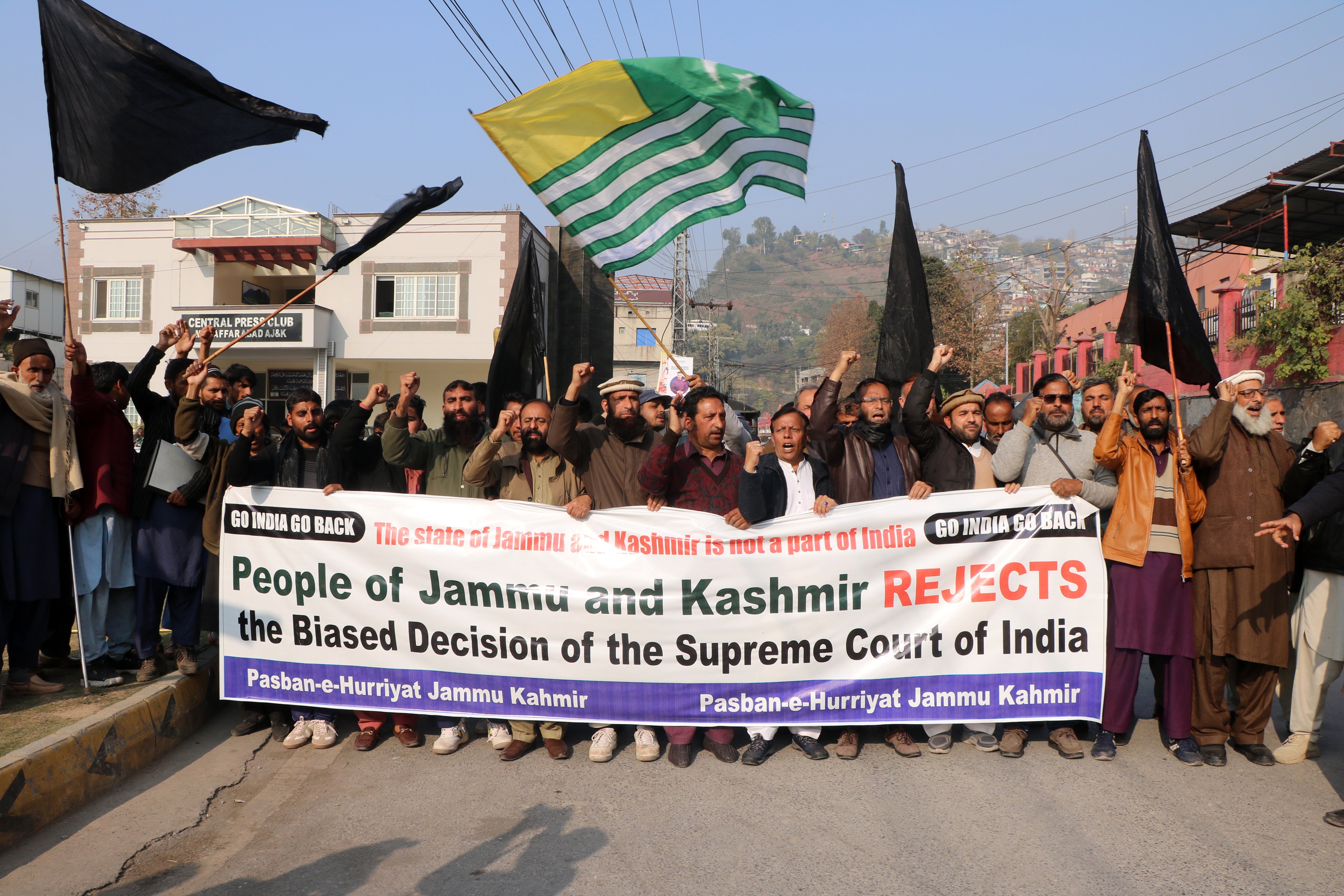 People gather to protest the upholding of the Indian government’s decision in Muzaffarabad