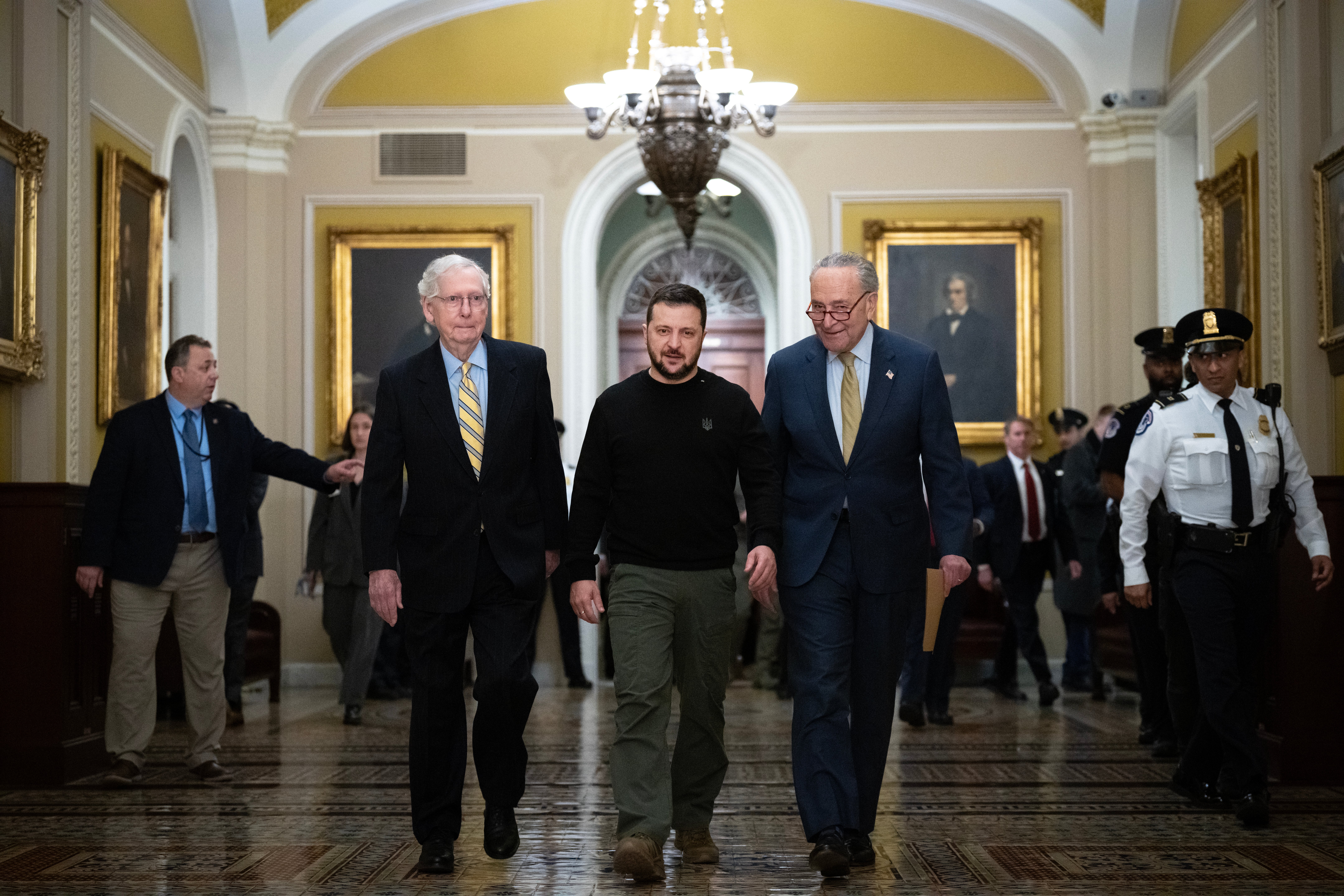 Walking with Senate Minority Leader Mitch McConnell (R-KY) and Senate Majority Leader Chuck Schumer (D-NY), Ukrainian President Volodymyr Zelensky arrives at the U.S. Capitol to meet with Congressional leadership on December 12, 2023 in Washington, DC