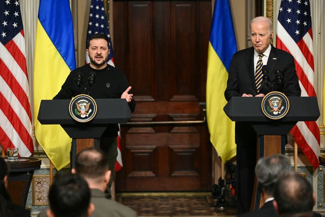 <p>US President Joe Biden and Ukraine's President Volodymyr Zelensky hold a joint press conference in the Indian Treaty Room of the Eisenhower Executive Office Building, next to the White House, in Washington, DC, on December 12, 2023</p>