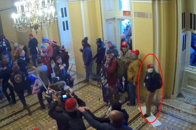 <p>A red circle identifies the man the FBI believes is Paul Caloia in the US Capitol on 6 January 2021.</p>